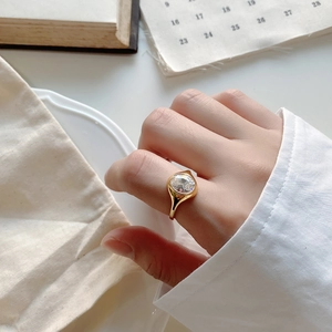 Gold 925 sterling silver ring with a large oval zircon on a model's hand
