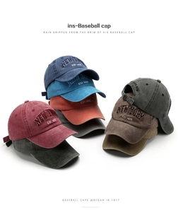 Detail of multi-color washed cotton baseball caps with New York 3D embroidery