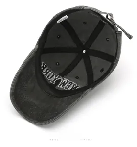Detail view of washed cotton baseball cap interior with NEW YORK embroidery and metal buckle