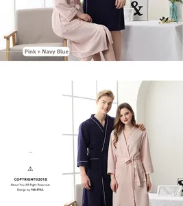 Detail of waffle weave texture on couple's pink and navy robes with belted waist
