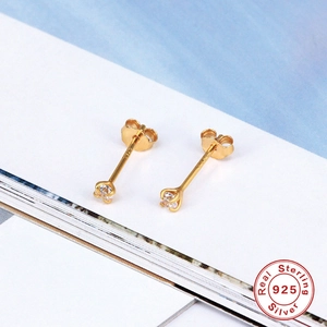 Close-up of S925 sterling silver gold stud earrings with four-claw round zircon