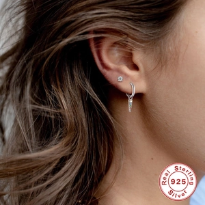 Close-up of S925 sterling silver hoop earring with colorful stone and cz stud on ear