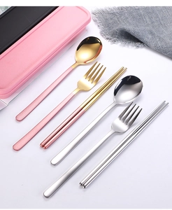 Close-up of pink and gold stainless steel cutlery set with a portable storage case