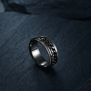 Titanium steel spinner ring with black chain on dark rock, hip hop jewelry accessory