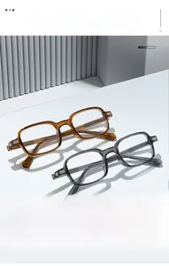 Detail view of TR90 square frame glasses showing metal striped texture on the spring hinges