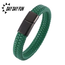 Detailed close-up of dark green braided leather bracelet with black matte metal clasp