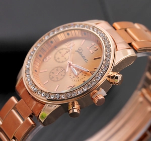 Close-up of Geneva rose gold watch featuring a rhinestone bezel and textured dial