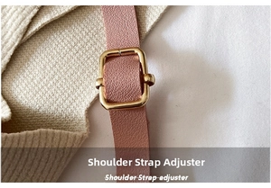 Close-up of pink leather shoulder strap with gold-tone adjustable metal buckle