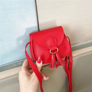 Mini red PU leather crossbody bag for girls with cute tassels and metal ring detail