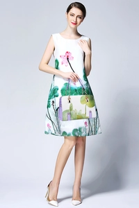 Detail of white handbag with purple handles and lotus print matching floral sleeveless dress