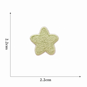 Detailed view of a 2.2cm green star embroidery patch with precise size measurements