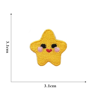 Detailed view of yellow cartoon star embroidery patch measuring 3.1cm by 3.1cm