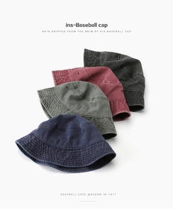 Detail view of four colors bucket hats showing vintage washed cotton and metal eyelets