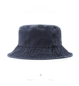 Macro detail of washed denim bucket hat featuring reinforced stitching and metal eyelets