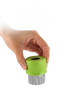 Detail of stainless steel vegetable cutter with ergonomic green PP hand protector