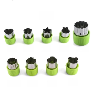 9-piece stainless steel vegetable cutter set with assorted shapes and green plastic handles