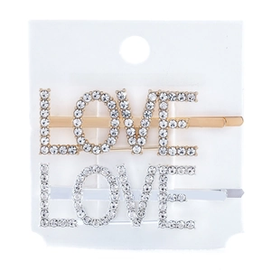 Close-up of LOVE letter hair clips set with sparkling rhinestones in gold and silver