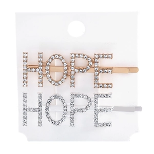 Macro view of HOPE word hair clips with sparkling rhinestones on display card