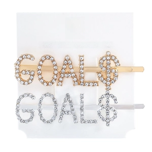 Close-up of gold and silver letter GOALS$ hair pins with sparkling rhinestone accents