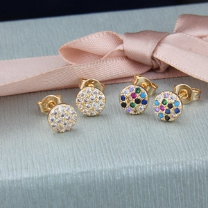 Detailed macro view of gold-plated hoop earrings with white and colorful cubic zirconia