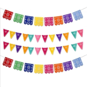 Detail of four colorful Mexican banners with traditional hollowed-out festive patterns