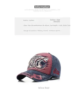 Detail view of washed cotton shark embroidery on a vintage style baseball cap