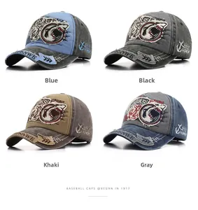 Detail view of four washed cotton baseball caps with shark and anchor embroidery