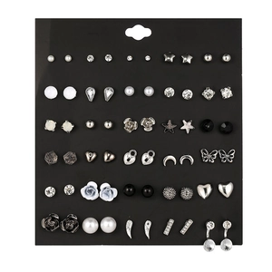 Detailed view of 30 pairs of assorted alloy stud earrings with pearls and crystals