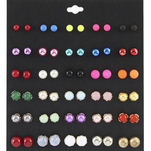 Detail of 36 pairs assorted stud earrings featuring pearls and rhinestones on black card