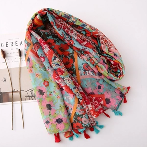 Floral print shawl with red tassels and poppy flower patterns on breathable fabric