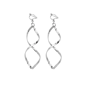 Macro shot of silver spiral ear clips featuring a sleek wavy design and metallic finish