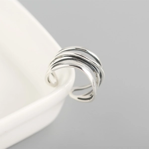 Detailed close-up of S925 sterling silver ear cuff featuring a multi-layer coil design