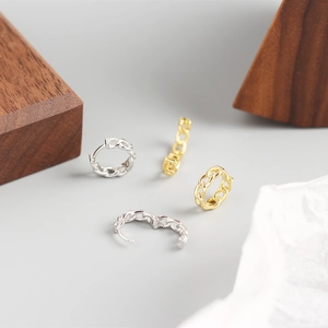 Detailed view of gold and silver S925 sterling silver chain link hoop earrings set