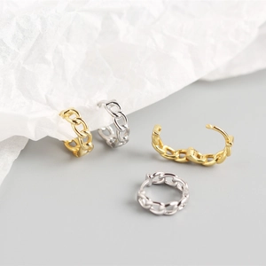 Detailed close-up of S925 sterling silver chain link hoop earrings in gold and silver finish