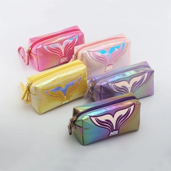 Detailed view of five iridescent mermaid tail makeup bags in vibrant pastel colors