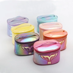 Macro view of holographic leopard print cosmetic bags with golden mermaid tail