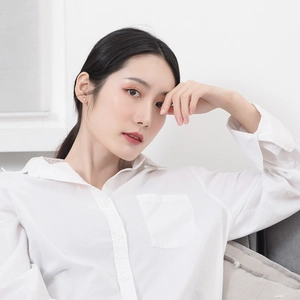 Elegant 925 sterling silver zircon stud earrings paired with minimalist white lapel shirt