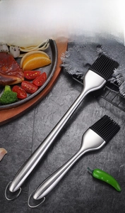 Macro detail of 304 stainless steel handles and heat-resistant silicone bristles on brushes
