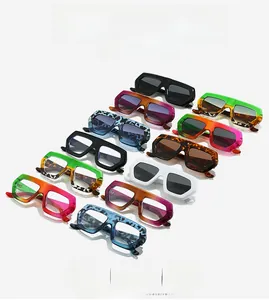 Flat lay of irregular oversized sunglasses in various colors and patterns for women