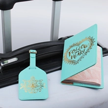 Mint green PU leather luggage tag and passport cover with gold foil on silver suitcase