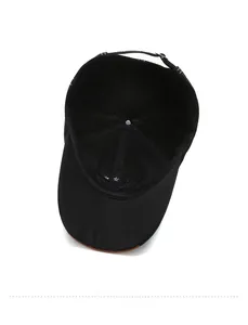 Internal view of black cotton baseball cap showing adjustable strap and star embroidery