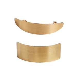 Matte gold minimalist metal hair clips with brushed finish in crescent and rectangle shapes
