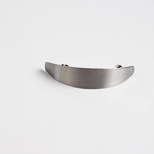 Detailed view of matte silver hair clip featuring a brushed metal finish and arc design