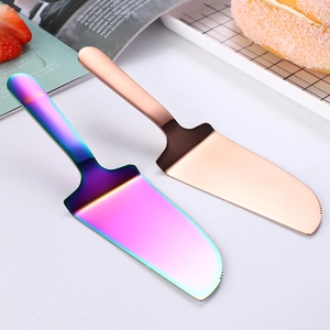 Rainbow and rose gold stainless steel cake server set with serrated edge on white background