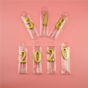 Gold metallic number candles in clear PVC boxes for birthdays and party celebrations