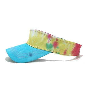 Detailed side view of tie-dye visor hat with vibrant colors and blue canvas brim