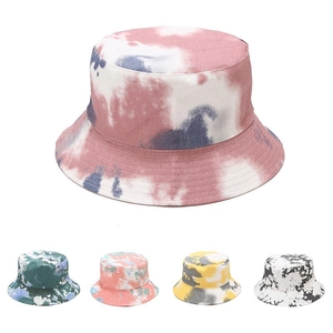 Detailed grid of tie-dye bucket hats in pink, green, and black cotton canvas colorways