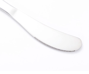 Macro view of 304 stainless steel butter knife with cartoon animal patterns and serrated edge