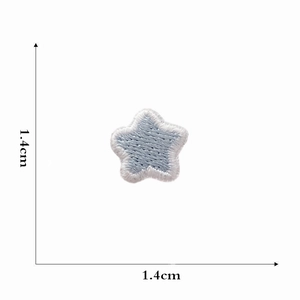 Detailed view of a blue star embroidered patch with dimensions 1.4cm by 1.4cm