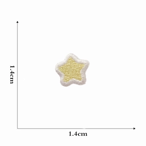 Detailed view of yellow star embroidered patch showing size dimensions 1.4cm x 1.4cm
